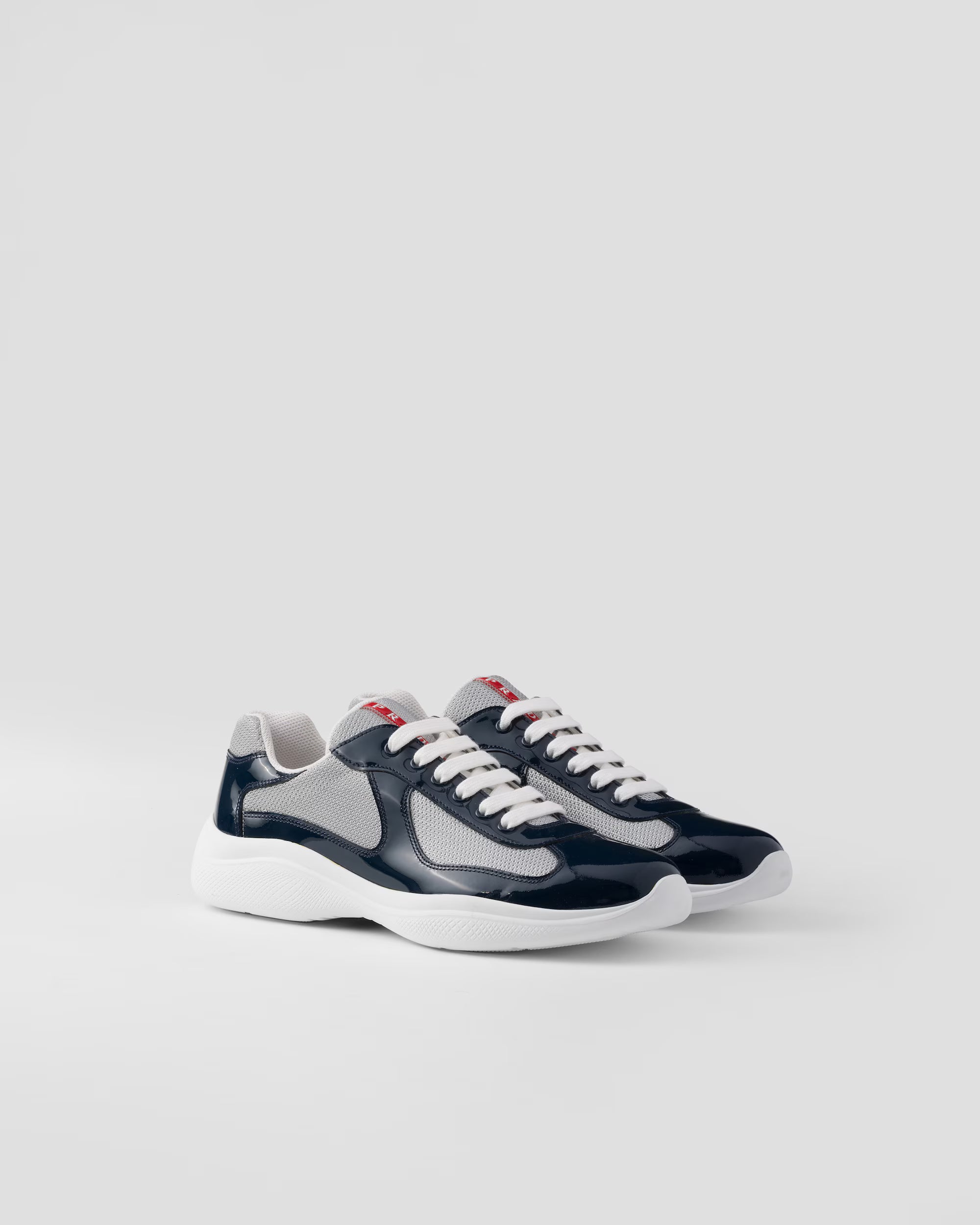 Sneakers Prada America’s Cup en cuir verni et tissu technique